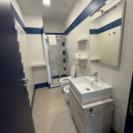 Residence Hall ensuite bathroom with sink, toilet, bidet, and shower